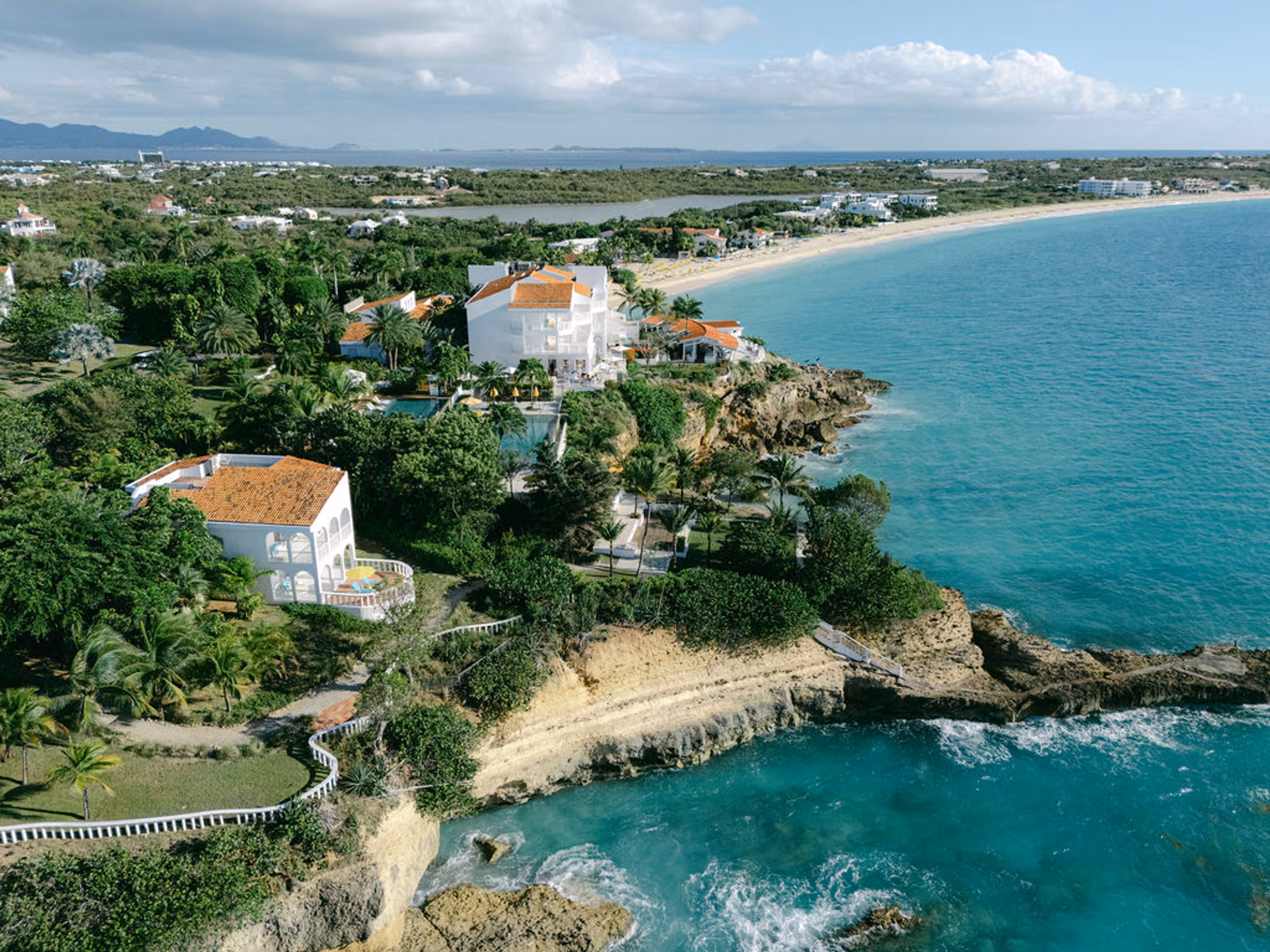 Bi-level infinity pool at Malliouhana overlooking the Caribbean Sea from a bluff